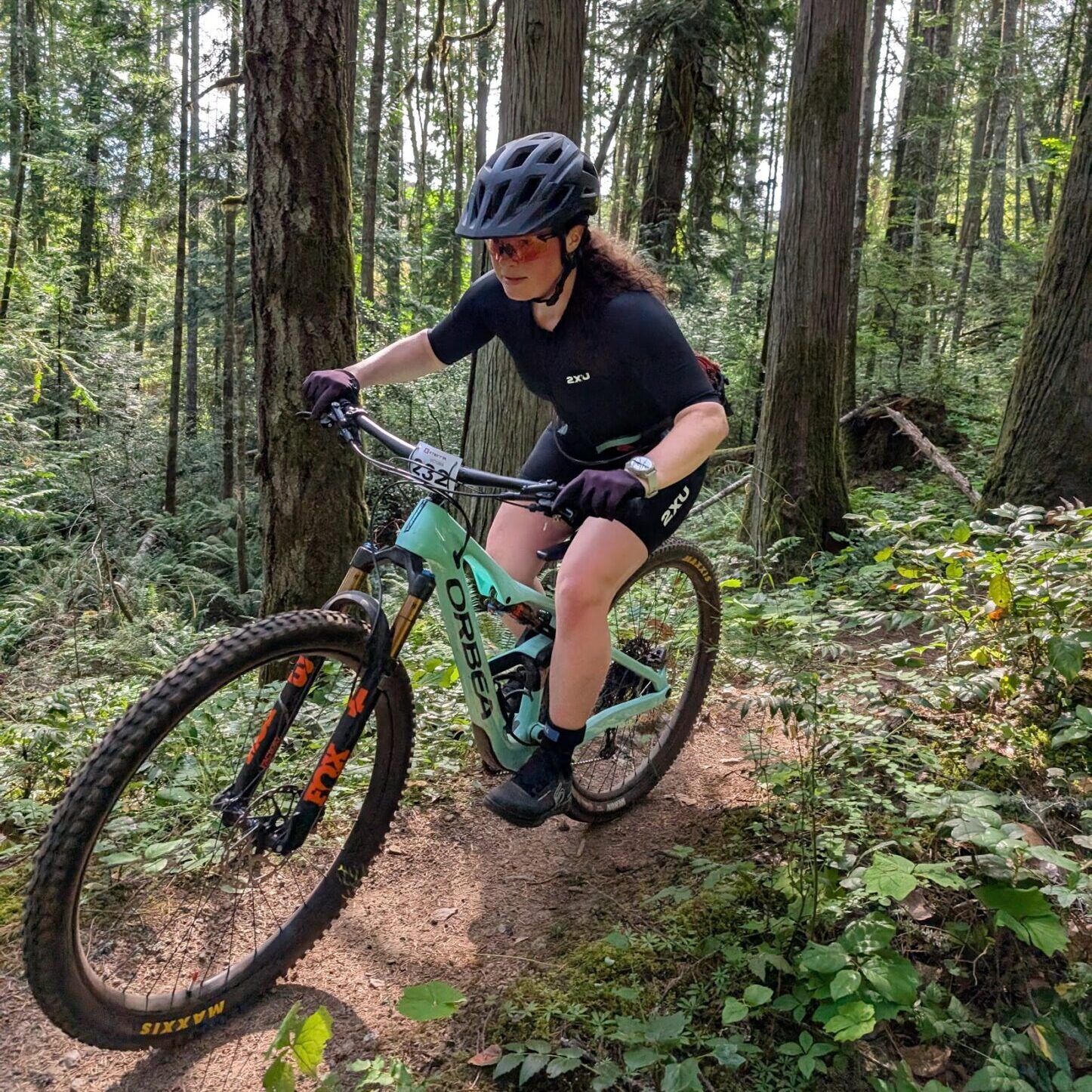 A cyclist blasts down a forest run at the Victoria X Tri.